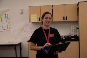 Cassandra Pollock talking to her students in the lab.