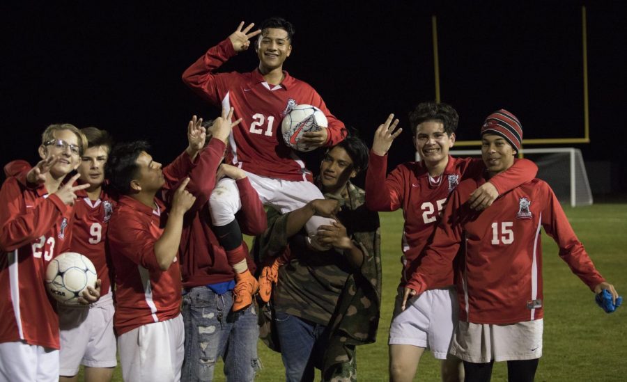 Sophomore Diego Soto Esquivel holds up three fingers in celebration of completing the hat-trick.