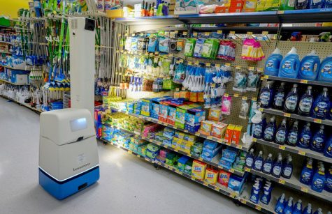 A robotic shelf scanner moves along an aisle at a North Richland Hills Walmart