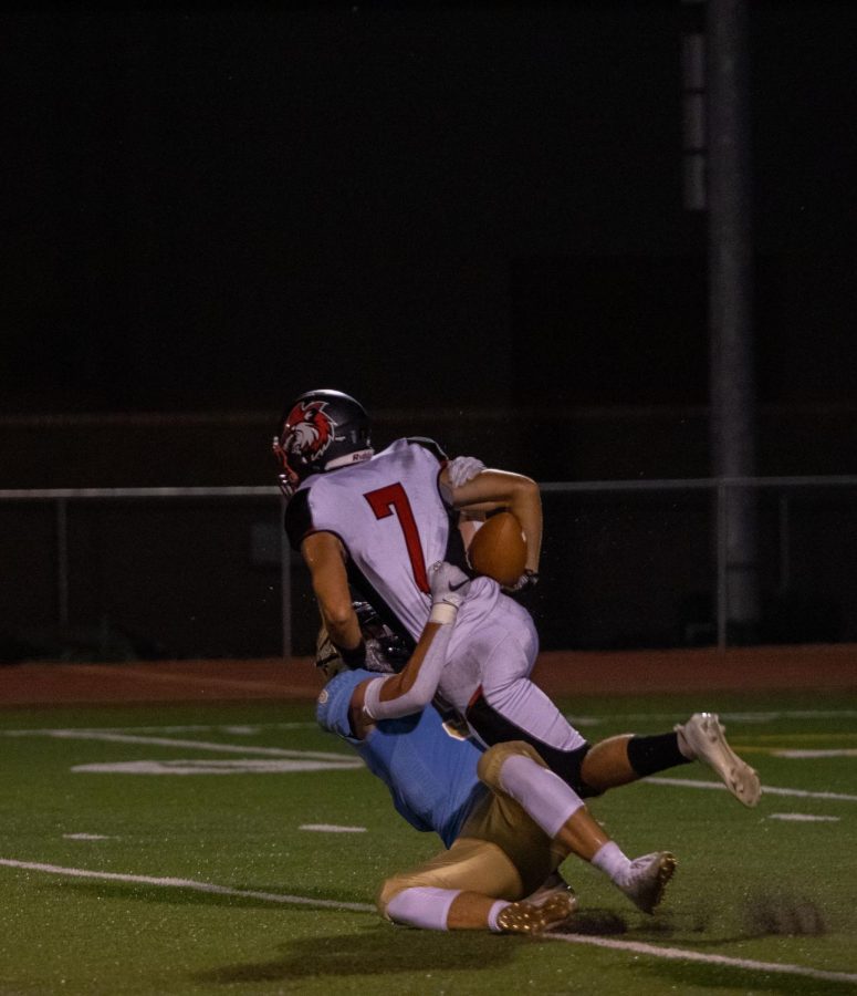 Senior Tanner Price gets tackled trying to run into the endzone.