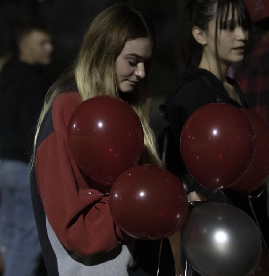 Senior Mieka Benedict mourns over her step brother Elijah Terrazas passing as they do a balloon ceremony.