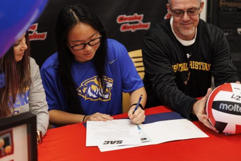 The moment shes been waiting for. Varsity volleyball team captain Alysen Harris signs her national letter of intent with the Central Christian College Tigers. 
