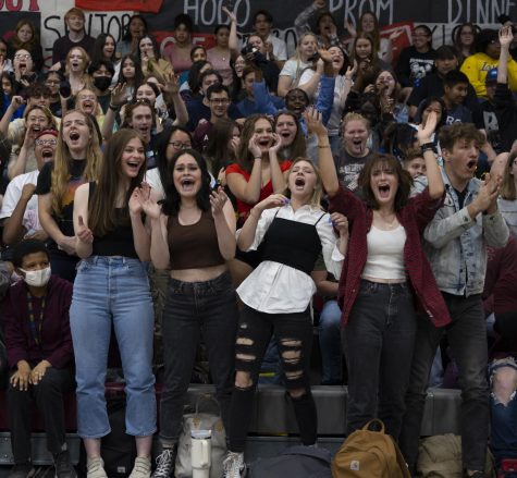 Seniors Savana Norton, Ella Stewart, Lara Shingleton, and Jayni Jorgenson stand from the front row and cheer as loud as they can for senior roll call. 
