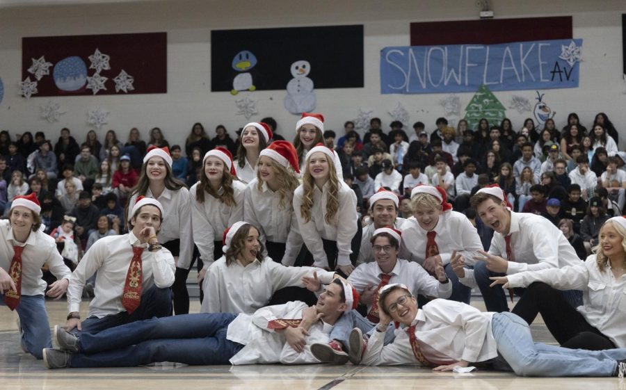 After introducing the assembly with a holiday dance, performers gather in the middle of the gym, posing for the end of the song.